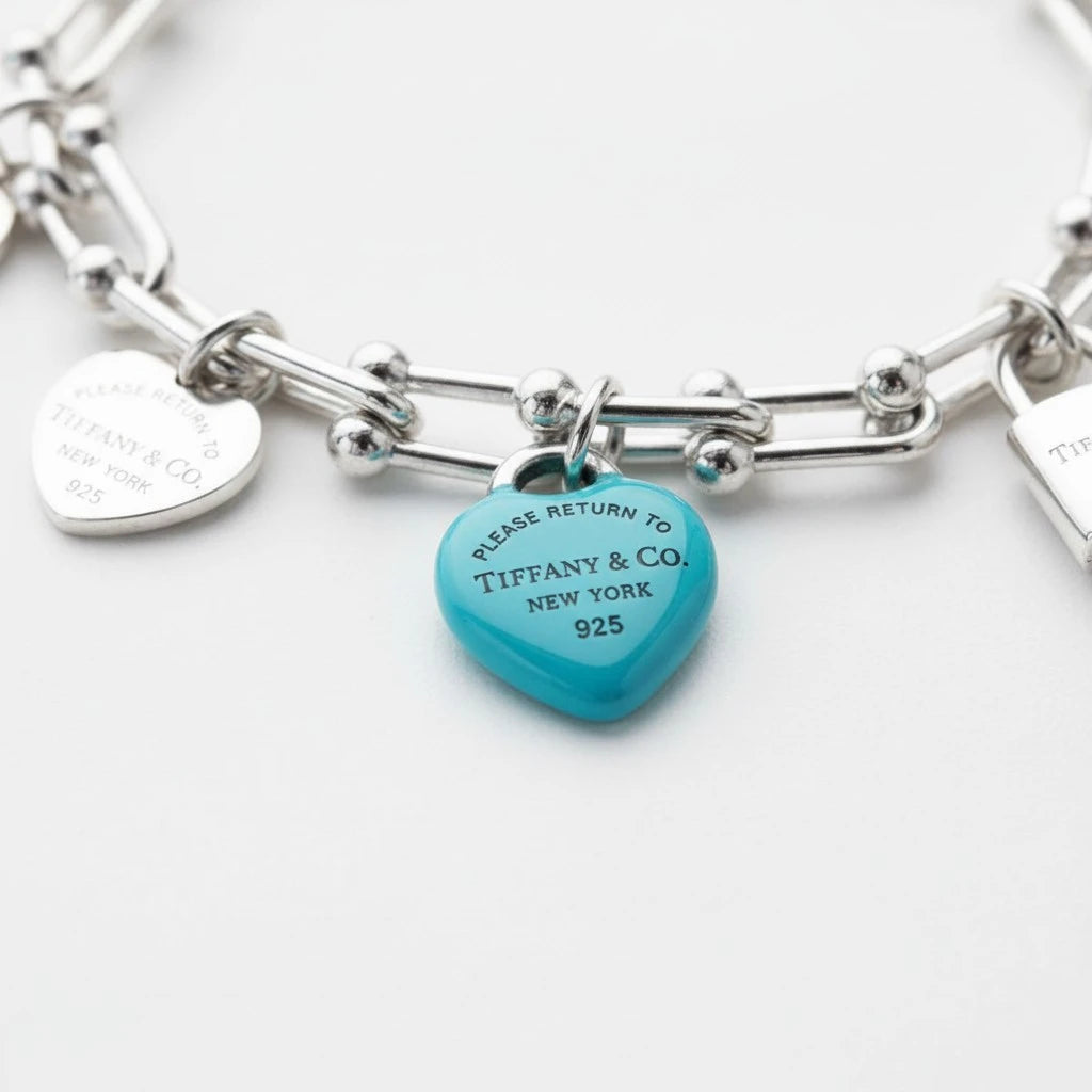 Pulsera Mi tienda 2 de eslabones en plata de ley 925 con dije de corazón azul turquesa y grabados icónicos